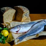 silver fish on white textile