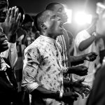 a group of men standing next to each other