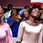 a group of women standing next to each other