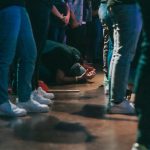 people standing on brown wooden floor
