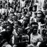 grayscale photo mass of people