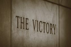the victory sign on the side of a building