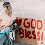 woman in pink shirt sitting on chair