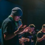 man in black shirt and gray knit cap