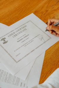 Close-Up Shot of a Person Signing a Document