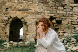 A Man in White Long Sleeve Shirt with Hands Together Praying