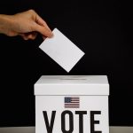 Photo Of Person Dropping A Vote