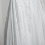 white textile near white wall