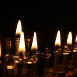 lighted candles on black background