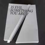 A book with the question "is evil something you are?"